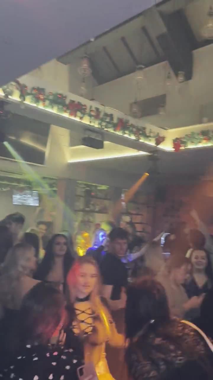 A packed dancefloor at a Christmas party with DJ Mark Hawley